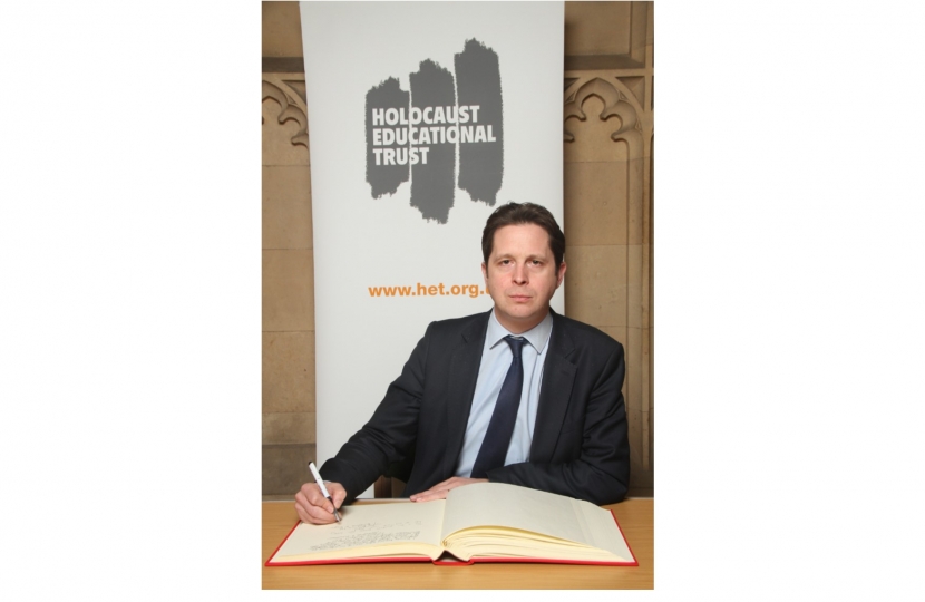 Alex Burghart MP signing the Holocaust Educational Trust’s Book of Commitment