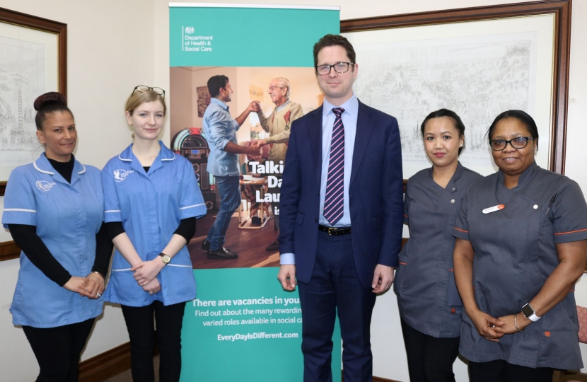 Alex Burghart MP with careworkers are launch of recruitment campaign